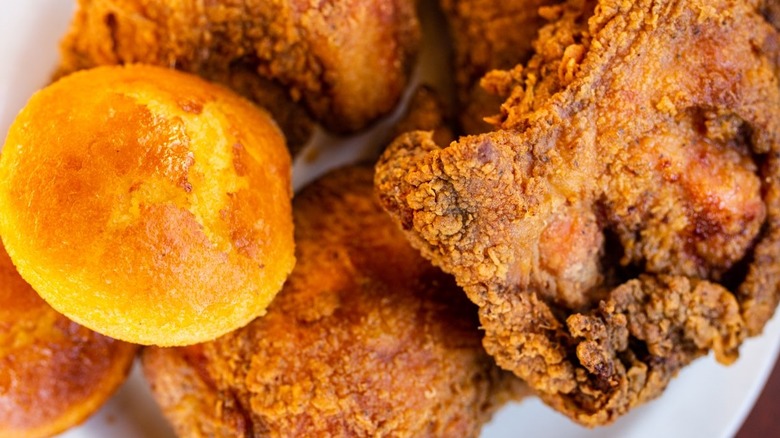 Aerial shot of fried chicken and cornbread muffins from Dulan's On Crenshaw