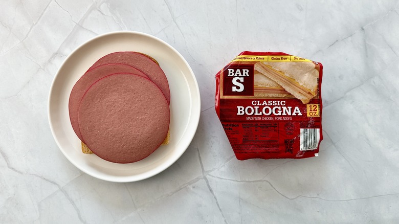 sliced bologna on bread with package of Bar S bologna alongside