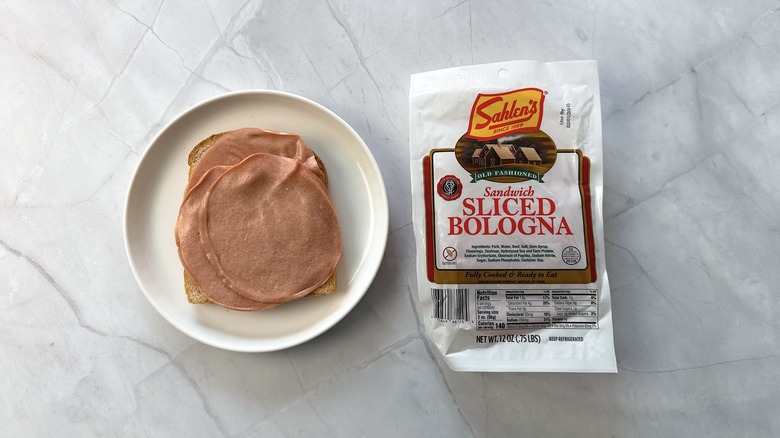 sliced bologna on bread with package of Sahlen's bologna alongside