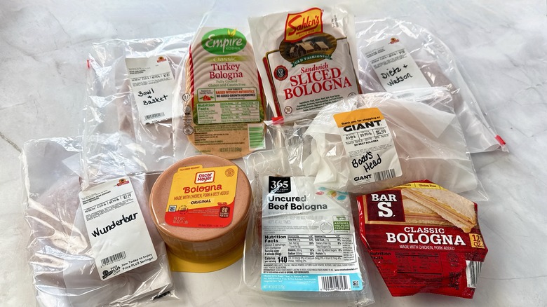 9 brands of bologna on a white counter