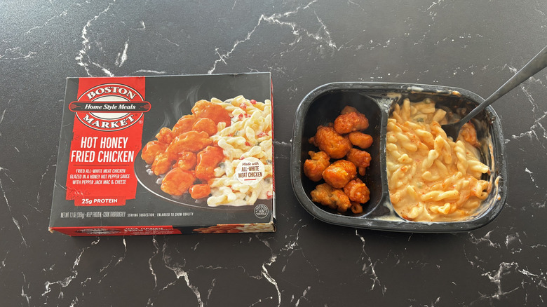 Boston Market hot honey fried chicken meal package next to hot honey fried chicken frozen meal