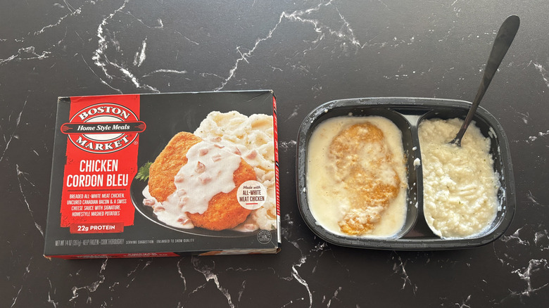 Boston Market chicken cordon bleu meal package next to chicken cordon bleu frozen meal