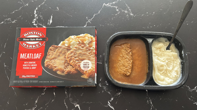 Boston Market meatloaf meal package next to meatloaf frozen meal