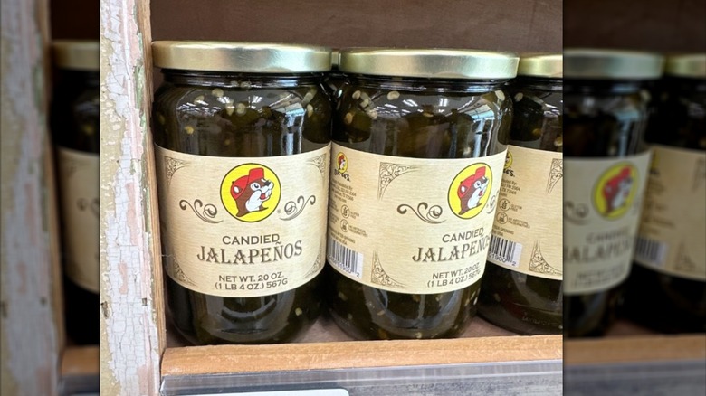 Jars of Buc-ee's candied jalapeños on a shelf at the store