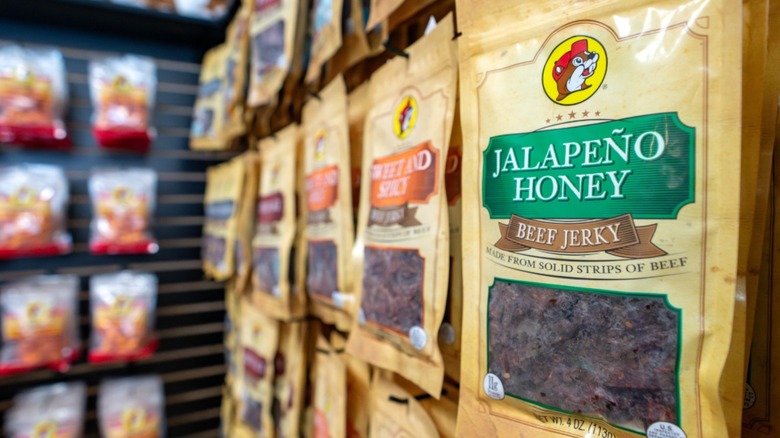 The shelf of jerky at Buc-ee's with Jalapeño Honey jerky in focus in the foreground