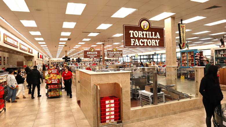 Customers shopping around the hot foods section at Buc-ee's