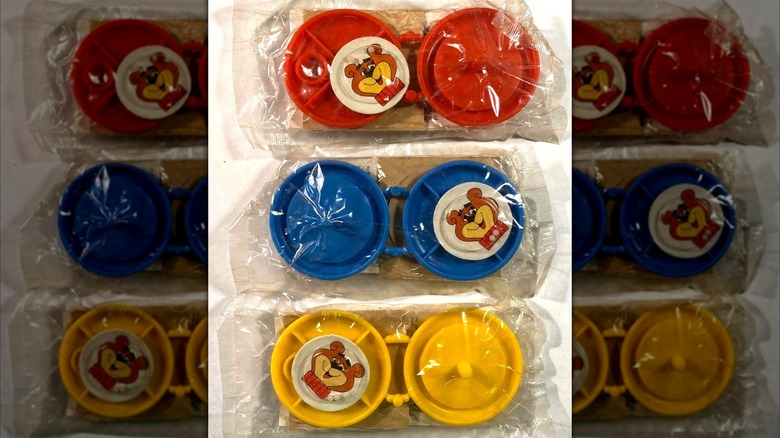 Three vintage Sugar Bear yo-yo toys in plastic packaging