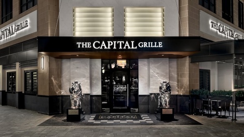Entrance to The Capital Grille restaurant with two statues