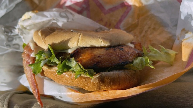 Carl's Jr. charbroiled chicken sandwich in paper wrapper