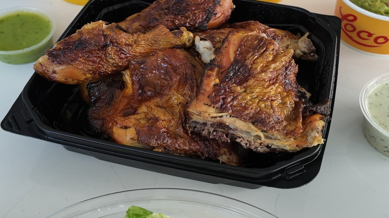 El Pollo Loco grilled chicken in black takeout container