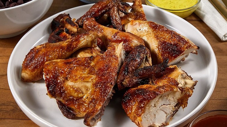 Pollo Tropical grilled chicken on white plate