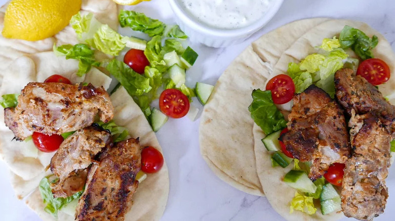 Easy Chicken Gyros with salad on kitchen countertop