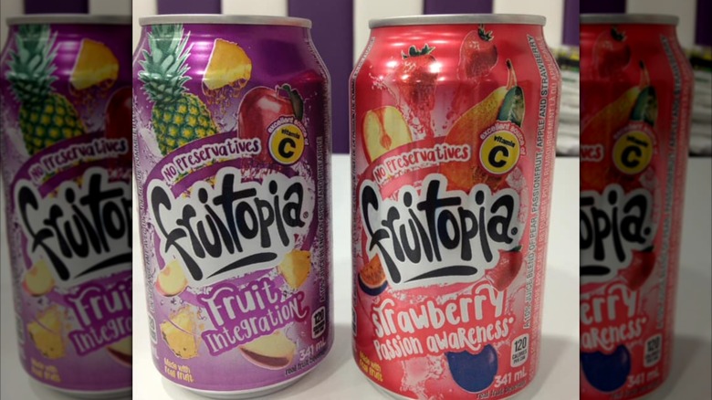 purple and red Fruitopia cans side by side