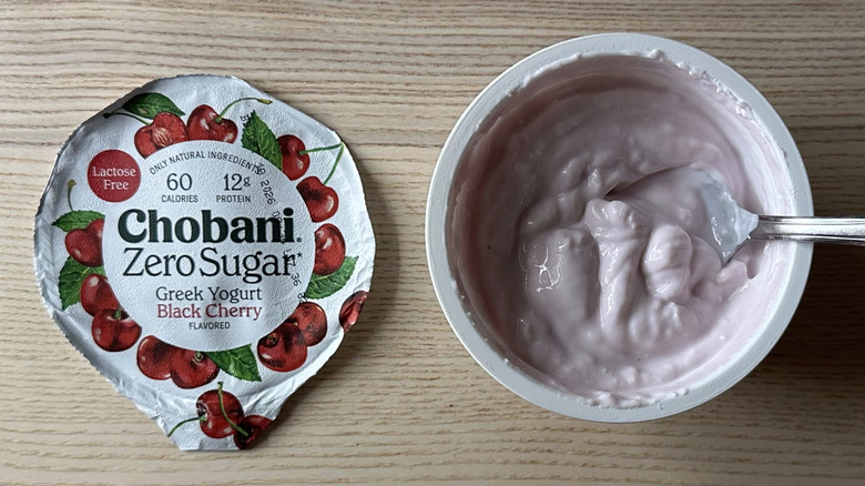 Black Cherry zero sugar Chobani yogurt on wooden table