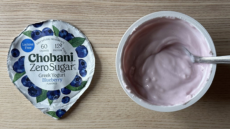 Blueberry zero sugar Chobani yogurt on wooden table