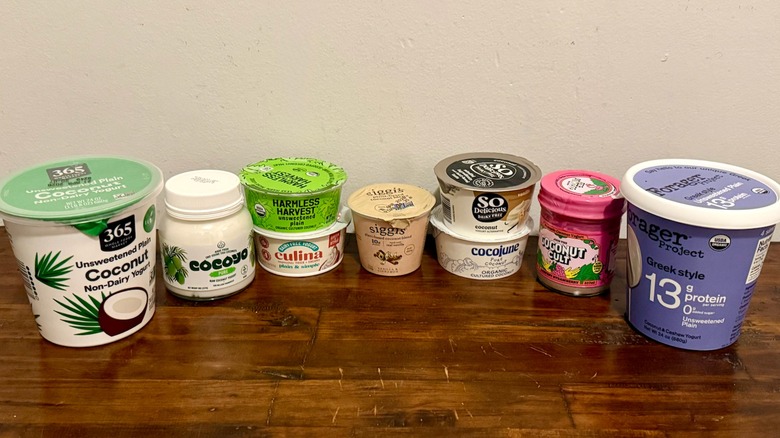 multiple brands of coconut yogurt lined up on table