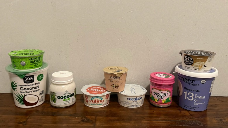 multiple containers of coconut yogurt on a table
