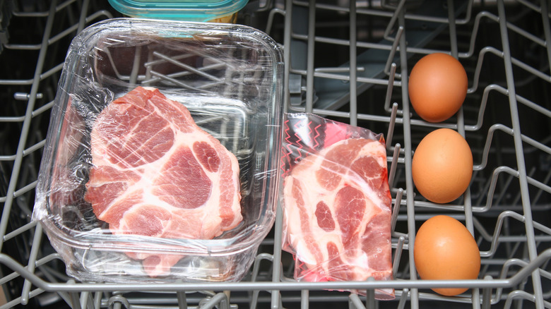 Cuts of raw meat in dishwasher