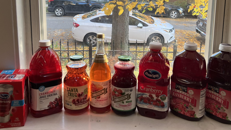 Cranberry juice bottles on table