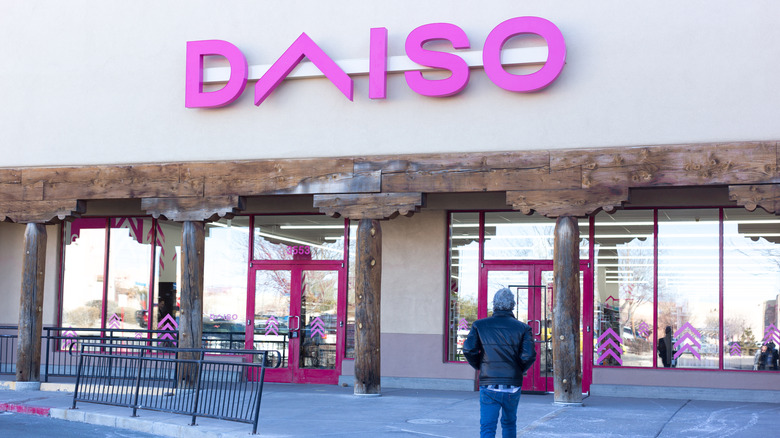 A man approaches Daiso store
