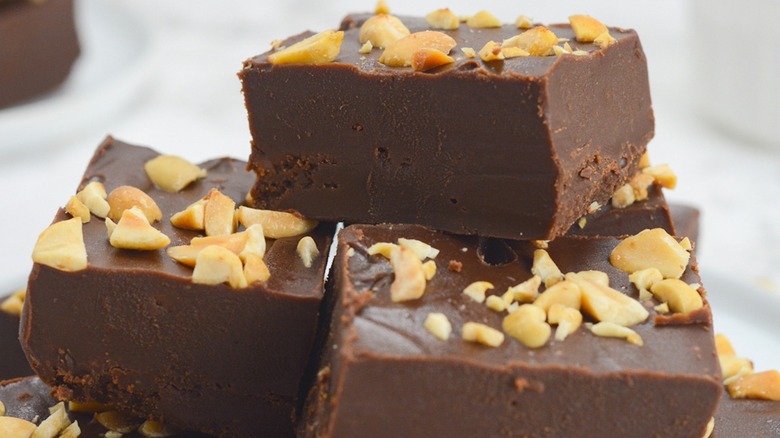 Close-up of a stack of nutty fudge pieces 
