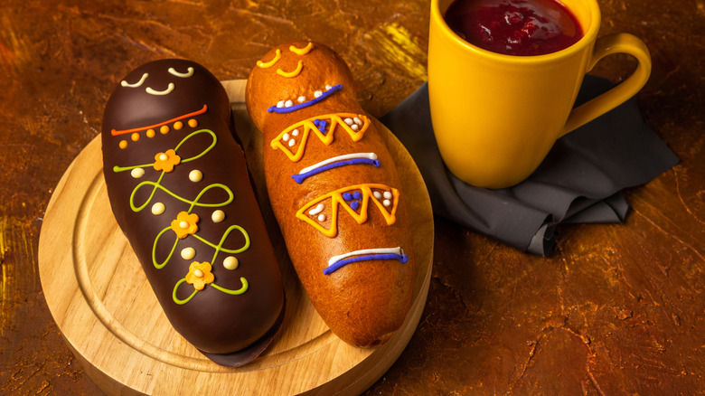 Guaguas de pan Ecuadorian decorated breads on round wooden board
