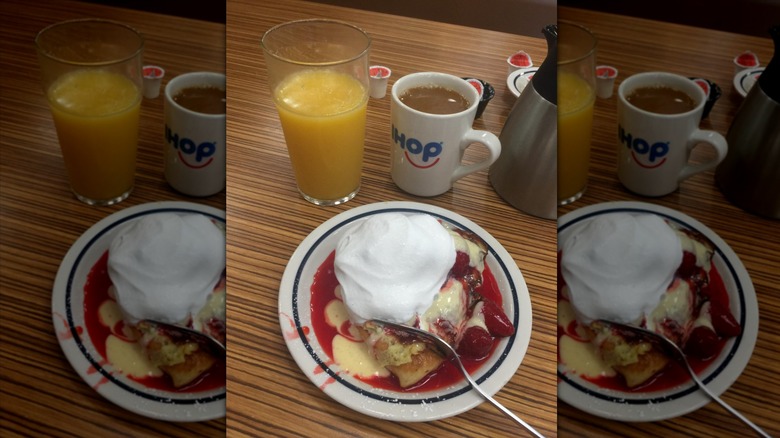 IHOP Cheesecake stuffed French toast on white plate with whipped cream