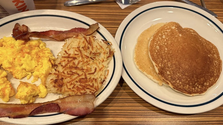 Gluten-free pancakes with savory breakfast on white plates