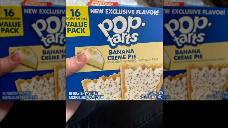 Hand holding box of banana creme pie Pop-Tarts