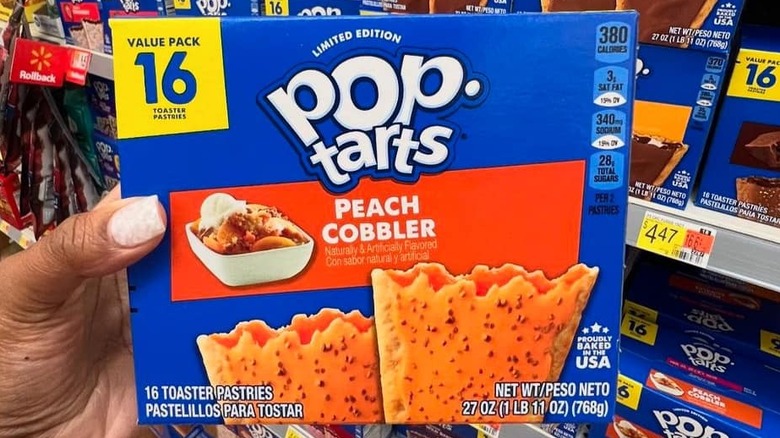 Hand holding peach cobbler Pop-Tart box
