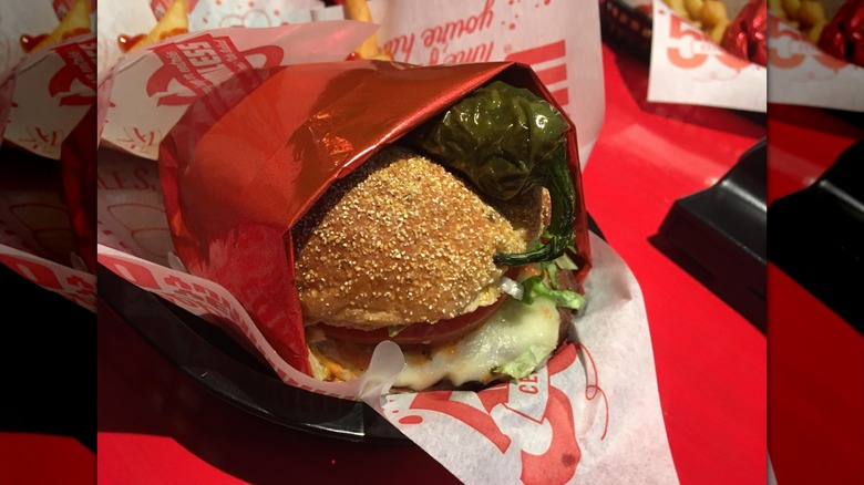 Wrapped Red Robin burger with whole grilled jalapeño pepper