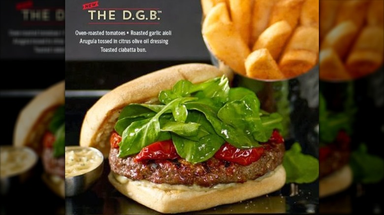 Ciabatta beef burger with roasted tomatoes and arugula