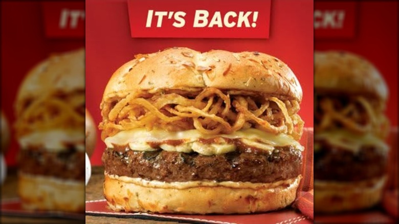 Beef burger with crispy onion straws and melty cheese