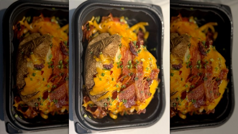 Wendy's baked potato in black to-go container