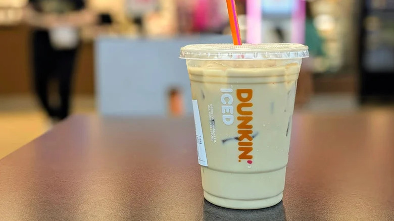 Dunkin' Cereal N' Milk Iced Latte on brown table