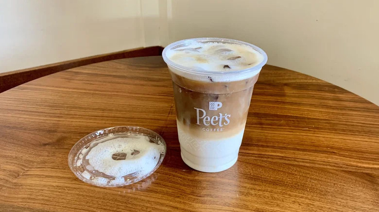 Peet's Coffee Cardamom Citrus Cold Brew Oat Latte on wooden table