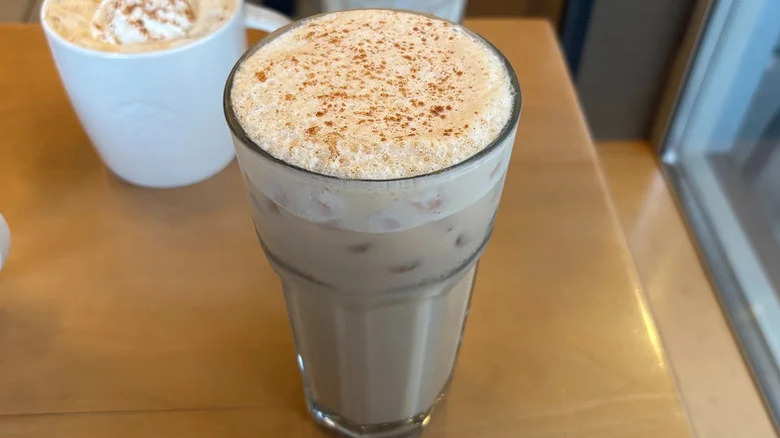 Iced pumpkin cream chai in glass cup from Starbucks