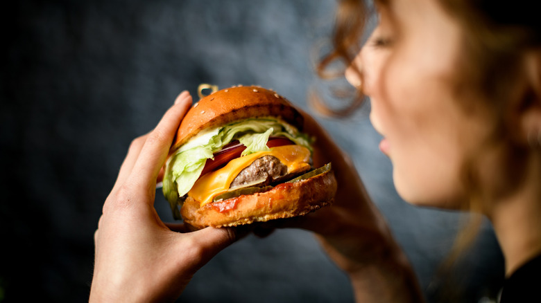 woman eating a buger