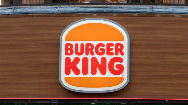 Burger King sign on side of wooden building