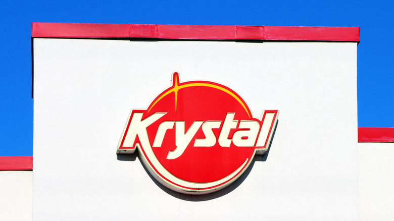Krystal sign on white building