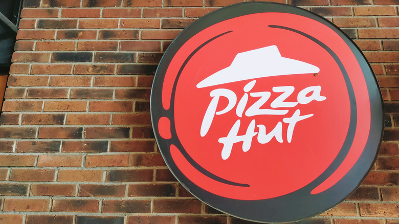 Pizza Hut sign on brick building