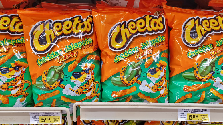 Cheetos Cheddar Jalapeno snacks on supermarket shelf