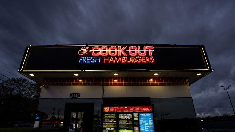 Front of Cook Out restaurant against dark cloudy night's sky