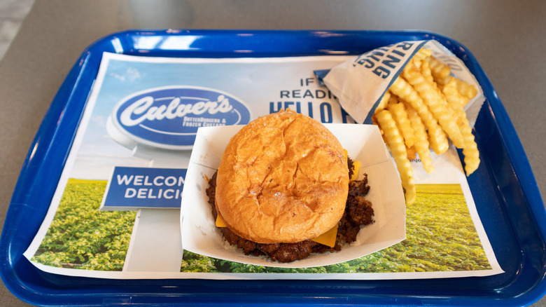 Culver's Fast Food Restaurant Butter Burger with French Fries on a blue Tray