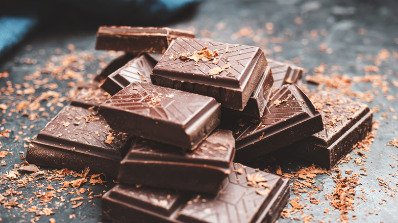 dark chcolate pieces on a dark table
