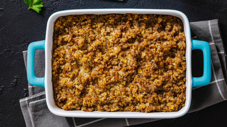 Rice and ground beef casserole in blue baking dish