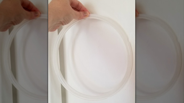 Hand holding silicone ring for Instant Pot