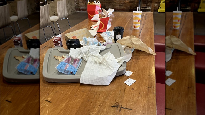 messy table at McDonald's, mirrored image