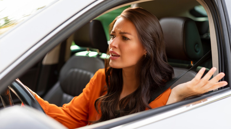 Stressed woman driving car