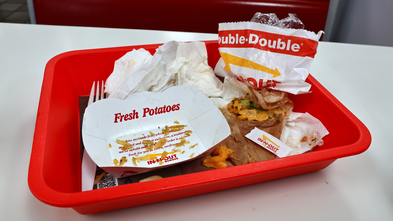 Double-Double meal leftovers on red tray